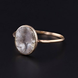 A side view of our antique Tree of life mourning ring set under rock crystal.  The ring is 18k and 14k gold.  It would be perfect for any georgian jewelry collector or antique jewelry lover.
