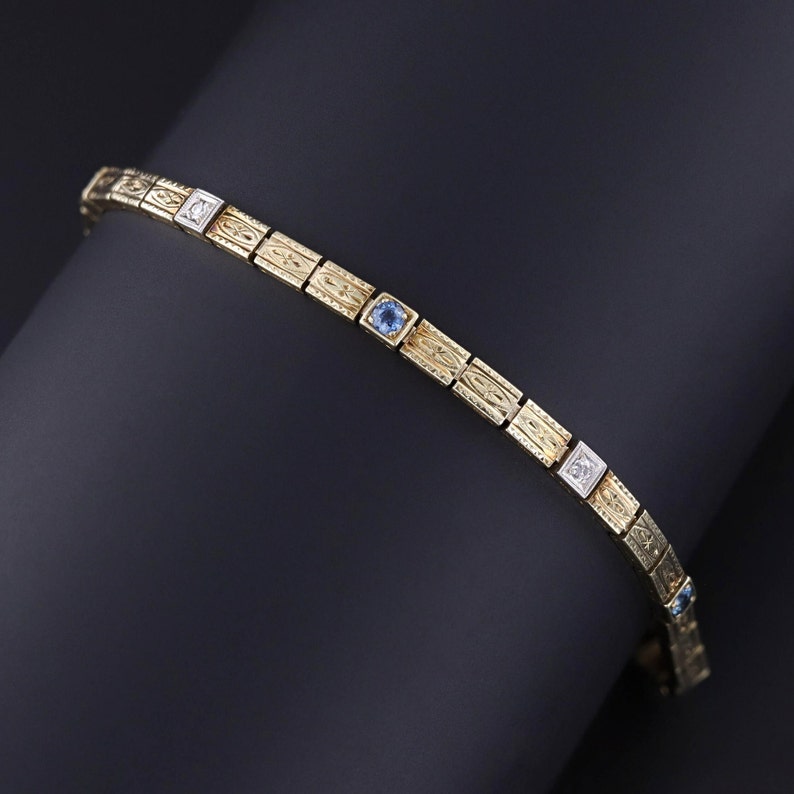 An Art Deco sapphire and diamond line bracelet adorned with sapphires and old European cut diamonds.  The bracelet measures 7.8 inches and is in excellent condition.