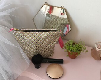 Make-up case in coated cotton with gold, pink and black patterns