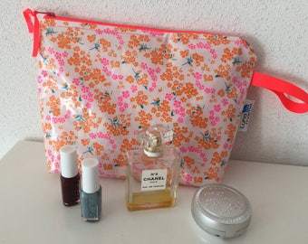 Makeup bag in coated cotton with neon pink patterns