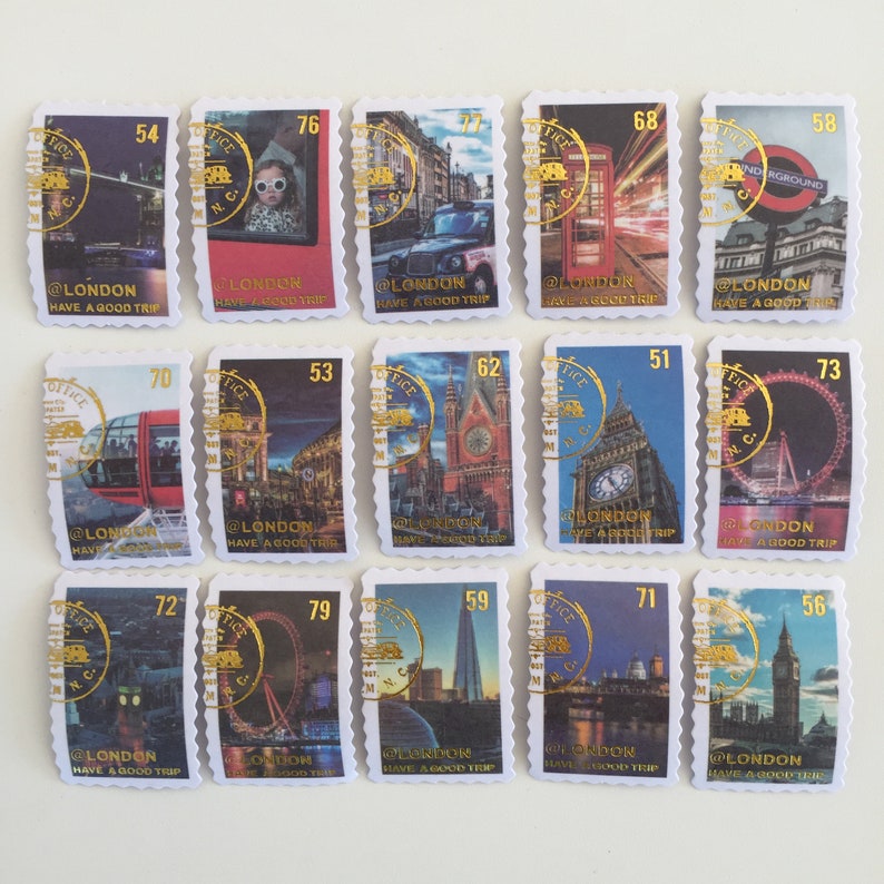 May include: A set of 12 London themed postage stamps featuring iconic landmarks like Big Ben, the London Eye, and the red double-decker bus. Each stamp has a gold border and the text "@LONDON HAVE A GOOD TRIP".