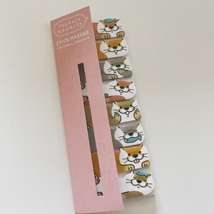 K&ouml;nnte beinhalten: Eine rosa und wei&szlig;e Packung Haftnotizen mit einem Cartoon-Otter-Design. Die Packung tr&auml;gt den Schriftzug "Youkoso Kawauoso Stick Marker 15 sheets x 8"
