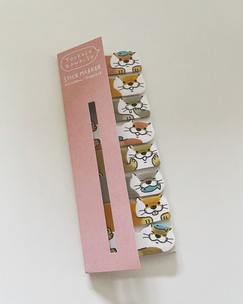K&ouml;nnte beinhalten: Eine rosa und wei&szlig;e Packung Haftnotizen mit einem Cartoon-Otter-Design. Die Packung tr&auml;gt den Schriftzug "Youkoso Kawauoso Stick Marker 15 sheets x 8"