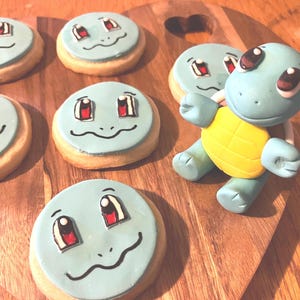 Pikachu and friends , Squirtle, Bulbasaur and Charmander cake toppers.