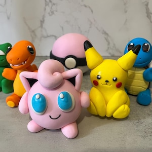 Pikachu and friends , Squirtle, Bulbasaur and Charmander cake toppers.