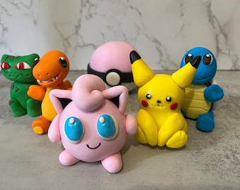 Pikachu and friends , Squirtle, Bulbasaur and Charmander cake toppers.
