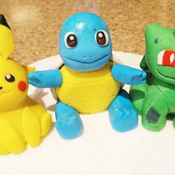 Pikachu and friends , Squirtle, Bulbasaur and Charmander cake toppers.