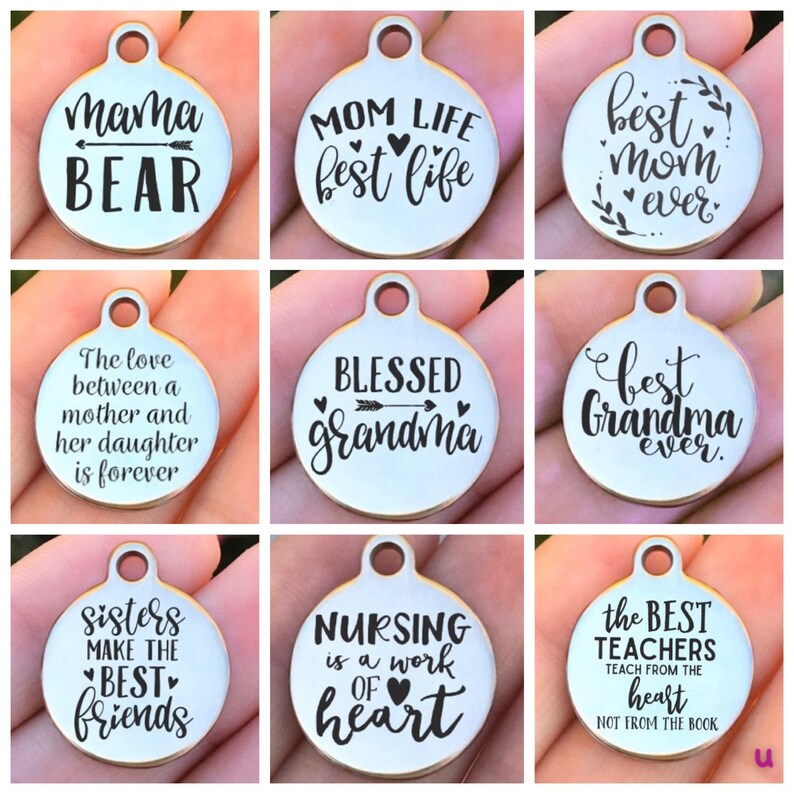 May include: Nine silver charm pendants with various sayings, including "Mama Bear", "Mom Life Best Life", "Best Mom Ever", "The Love Between a Mother and Her Daughter is Forever", "Blessed Grandma", "Best Grandma Ever", "Sisters Make the Best Friends", "Nursing is a Work of Heart", and "The Best Teachers Teach From the Heart, Not From the Book".