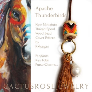 May include: A beaded thread spool cover with a geometric pattern in shades of orange, yellow, blue, and brown. The cover is attached to a brown leather cord with a gold ring and a brown tassel. The text "Apache Thunderbirds" is visible in the image.