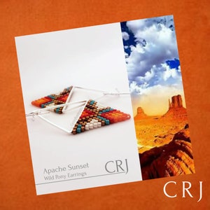 May include: A pair of silver hoop earrings with a triangular beaded design in shades of orange, red, brown, white, and turquoise. The earrings are called "Apache Sunset Wild Pony Earrings" and are by the brand "CRJ".