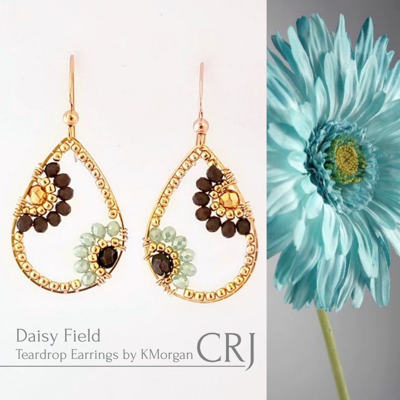 May include: Gold teardrop earrings with brown, gold, and green beads. The earrings are shaped like a teardrop and have a small flower design in the center. The earrings are called "Daisy Field Teardrop Earrings by KMorgan".