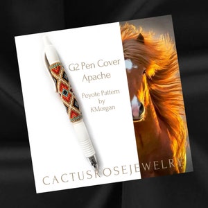 May include: A white pen with a beaded cover in red, orange, blue, and black colors. The pen cover is labeled "G2 Pen Cover Apache Peyote Pattern by KMorgan" and "Cactusrosejewelry".