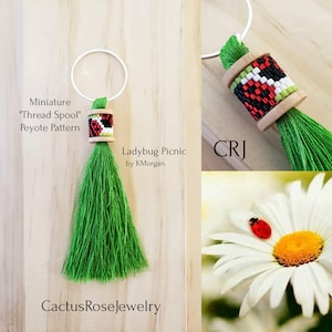 May include: A miniature "Thread Spool" peyote stitch beaded charm with a green tassel, a ladybug picnic theme, and the text "Ladybug Picnic by KMorgan" and "CactusRoseJewelry".
