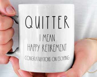 May include: White ceramic coffee mug with black text that reads "Quitter I mean Happy Retirement Congratulations on Escaping".