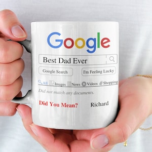 May include: White ceramic mug with a Google search bar that says "Best Dad Ever". The search results say "Did not match any documents. Did You Mean? Richard"