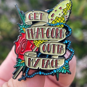 Get That Corn Outta My Face 1.75 inch soft enamel pin from Nacho Libre inspired design by JesseJFR