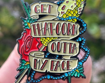 Get That Corn Outta My Face 1.75 inch soft enamel pin from Nacho Libre inspired design by JesseJFR