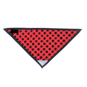 May include: Red and black checked bandana with a black border and a reflective patch on the bottom point.