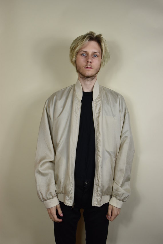 cream colored bomber jacket