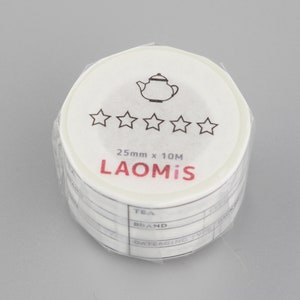 May include: White washi tape roll with a black teapot and five stars printed on the front. The text "25mm x 10M LAOMi'S" is printed below the stars. The tape has a black and white design with the words "TEA, BRAND, DATE/AGING" printed on the roll.