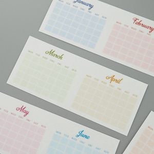 May include: A set of six monthly calendar cards with a pastel color gradient for each month. The months are January, February, March, April, May, and June. Each card has a grid for the days of the week, with the days of the week labeled at the top.