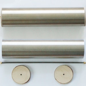 May include: Two silver metal curtain rods with end caps and a metal hook. Two wooden end caps are also included.