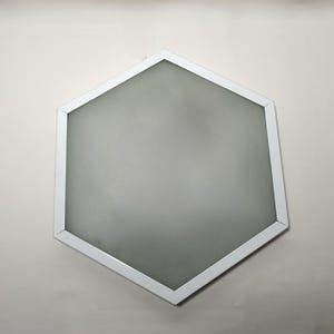 May include: A white hexagonal ceiling light fixture with a frosted glass diffuser.