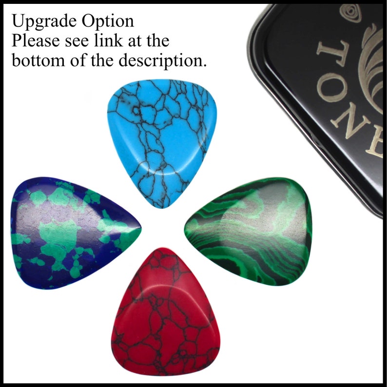 This image shows the upgrade option, which is one of each of the 4 stone tones Guitar Picks in a black gift tin. Blue Dragon Skin, Green Lizard skin, bloody Basin Jasper and Malachite Azurite. Link at the bottom of the description.