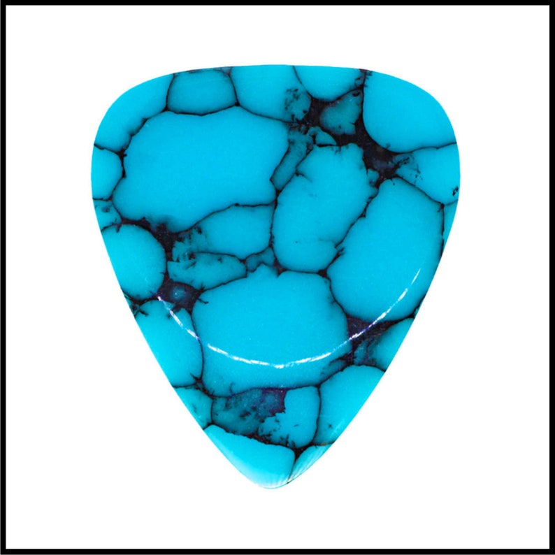 This image show 1 Blue Dragon Skin Reconstituted Stone Guitar Pick. These plectrums have black veins running through a blue background. It is placed on a white background with the light reflecting off the chamfer to show the 3D shape of the pick.