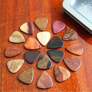 18 Exotic Timber Tones Guitar Picks in a Gift Tin - These Guitar Picks can be customised with your own personal message or Band Logo