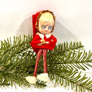 May include: A set of three ceramic mugs with a speckled, matte finish. The mugs are in shades of cream, light brown, and dark brown. Each mug has a simple, minimalist design, perfect for coffee or tea.