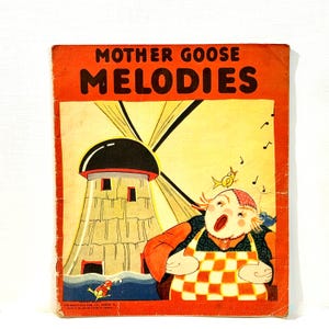 May include: Vintage "Mother Goose Melodies" book with a red cover. The cover features a cartoon illustration of a singing character with a windmill in the background. The book has a worn appearance.