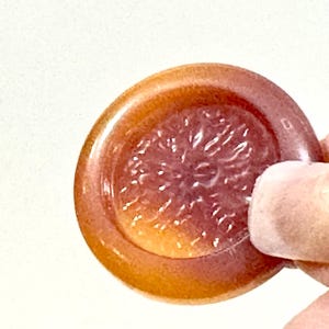 May include: A set of three ceramic mugs with a speckled, matte finish. Each mug features a different color: light blue, cream, and gray. The mugs have a simple, modern design and a comfortable handle.