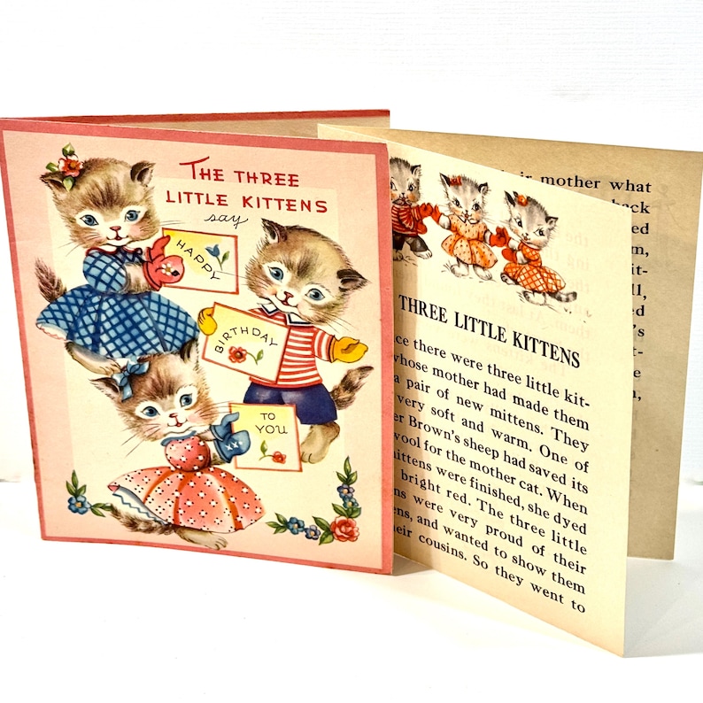 May include: Vintage children's book featuring illustrations of kittens. The cover shows three kittens holding signs that say "Happy Birthday to You." The book's title is "The Three Little Kittens."