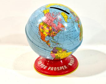 Globo terráqueo de los años 50, hucha de hojalata litografiada, Ohio Art Co., "Ahorra para prosperar".