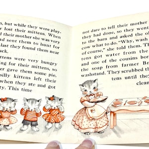 May include: A vintage children's book illustration featuring three kittens in dresses and a kitten in an apron. The kittens are depicted with closed eyes, and the illustration has a classic, storybook style.