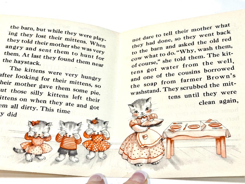 May include: A vintage children's book illustration featuring three kittens in dresses and a kitten in an apron. The kittens are depicted with closed eyes, and the illustration has a classic, storybook style.