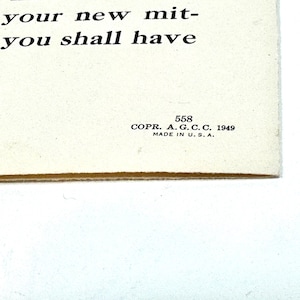 May include: A vintage cream-colored paper with printed text and a floral illustration. The text reads "ept your new mit- hat you shall have." Includes the text "COPR. A. G. C. C. 1949 MADE IN U.S.A." and the number 558.