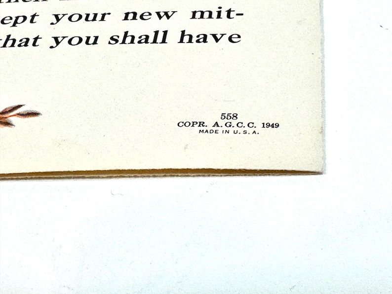 May include: A vintage cream-colored paper with printed text and a floral illustration. The text reads "ept your new mit- hat you shall have." Includes the text "COPR. A. G. C. C. 1949 MADE IN U.S.A." and the number 558.