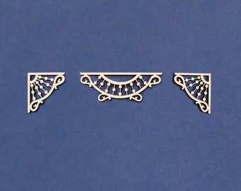 May include: Three wooden corner and arch embellishments with a decorative design. The embellishments are white and have a delicate, intricate pattern.