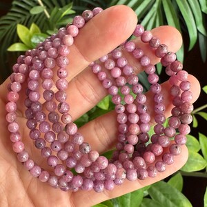 Pulseira de rubi, reativa a UV, com contas redondas de 5 mm.