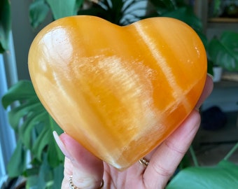 Large orange calcite heart, extra gemmy