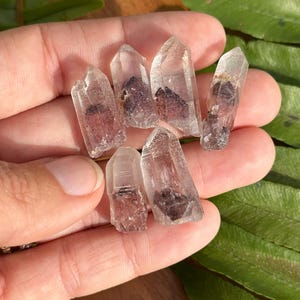 One small red phantom hematite quartz point, Indian sunset phantom, natural and raw