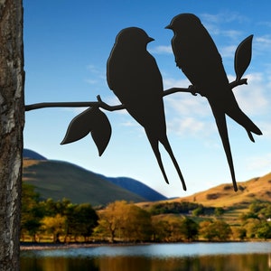 Black barn swallows metal bird art for tree or fence posts and more.