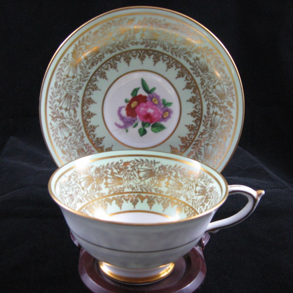 Paragon Footed Tea Cup and Saucer Mint Green with Gold Filigree Flower Bouquet