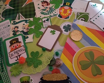 May include: A collection of St. Patrick's Day themed craft supplies, including green shamrocks, a leprechaun, a pot of gold, and a card that says "St. Patrick's Day".