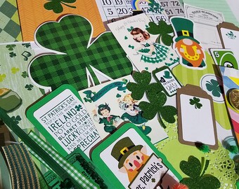 May include: A collection of St. Patrick's Day themed paper crafts, including a green shamrock, a leprechaun, a bingo card, and a card that says "St. Patrick's Day".