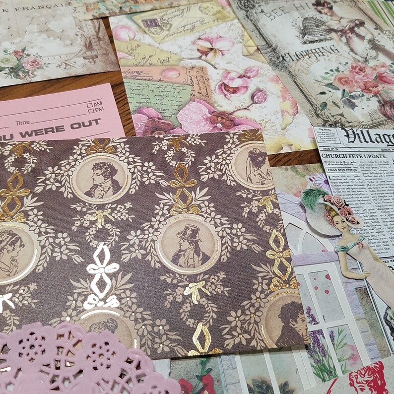 May include: A brown patterned paper with gold accents featuring a repeating design of oval frames with portraits of people. The paper has a vintage aesthetic and is perfect for scrapbooking or crafting.