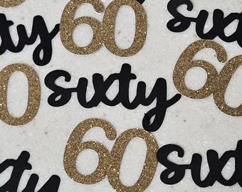 May include: Gold glitter 60s and black "sixty" cutouts for a 60th birthday party.