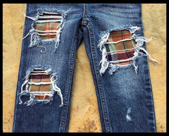 ripped repaired jeans